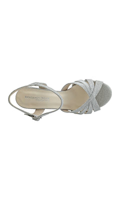 A top view of the Maeve Silver Glitter Prom Shoes (Touch Ups 4528) shows crisscross straps, an ankle buckle, and an open toe; the insole is labeled "BENJAMIN WALK TOUCH UPS." Perfect for prom.