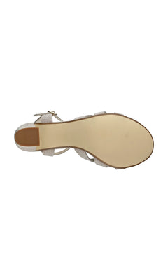 A top-down view of the Maeve Champagne Glitter Prom Shoes: Touch Ups 4529 shows an open-toe sandal with a smooth beige sole, glittery metallic straps, and a buckle at the heel—ideal for prom.