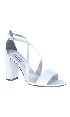 The Micah White Crepe Prom Shoes by Dyeables (4321) feature block heels, an open-toe design, and a crisscross ankle strap with a classic buckle closure—perfect for prom.
