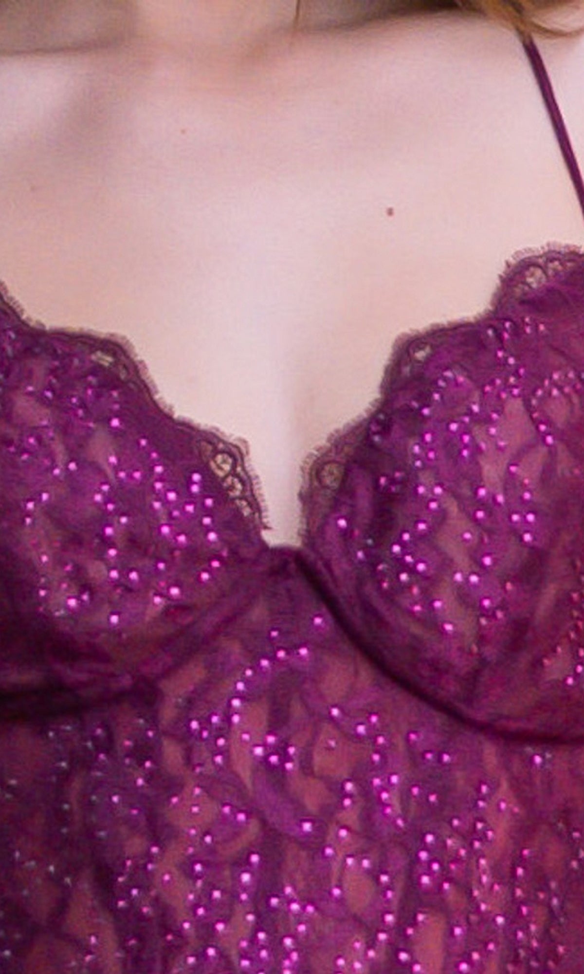 A close-up of a person wearing the Velvi Lace-Bodice Long Lace-Up Prom Dress Misha, featuring purple sequins, thin straps, and sheer-lace corset detailing.