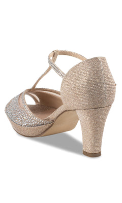 The Nora Champagne Prom Shoes: Paradox London P2225 are gold glittery heeled sandals with a closed heel, open toe, ankle buckle, and front rhinestone detail—ideal for prom.