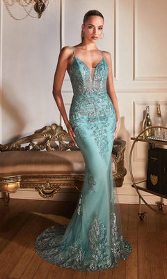 A woman stands in an elegant, vintage-decor room wearing the Sheer-Corset Sleek Long Glitter Prom Dress OC007, a fitted teal mermaid gown with intricate silver embellishments.