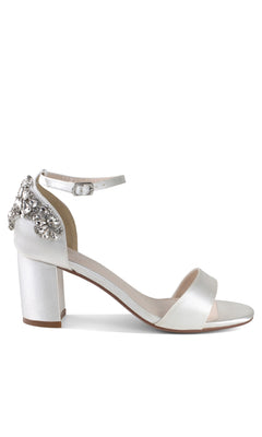 The Olivia White Satin Prom Shoes: Dyeables 4635 feature block heels, an ankle strap, jeweled detailing, and silver crystal accents for a glamorous finish.