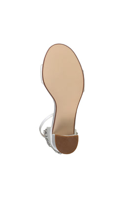 Bottom view of the Olivia White Satin Prom Shoes (Dyeables 4635) featuring block heels, a light tan sole, and textured brown grip on the heel.