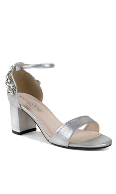 The Olivia Silver Shimmer Prom Shoes (Touch Ups 4636) feature a silver block heel, ankle strap, jeweled heel accents, open toe, and a single front strap—perfect as stylish silver prom shoes.