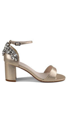 The Olivia Champagne Shimmer Prom Shoes (Touch Ups 4637) feature a gold block heel, ankle strap, shimmer accents, and decorative rhinestones on the heel.