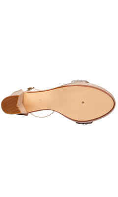 A bottom view of the Parker Champagne Glitter Prom Shoes by Touch Ups 4659 features a beige sole, metallic upper, ankle strap, and textured heel—ideal for adding sparkle to your look.