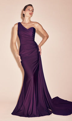 A woman wears the Plus-Size Long Sweetheart Prom Dress PT004C—a fitted, floor-length purple gown with a small train—posing against a plain light background.