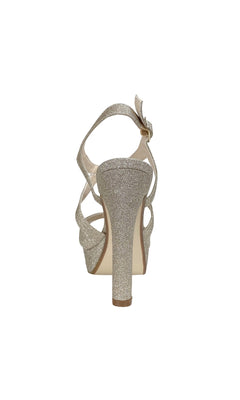 Rear view of the Queenie Champagne Glitter Prom Shoe (Touch Ups 4223), an open-toe heel with sparkling straps and a decorative bow on the ankle strap—ideal for those seeking glamorous 4-inch heels.