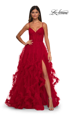A woman models the Ruffled-Tulle Long Prom Ball Gown: La Femme 32719, featuring a red lace corset bodice, spaghetti straps, ruffled skirt with high slit, against a white background with the "La Femme" logo in the top right corner.