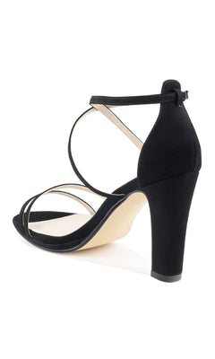 Reign Black Formal Prom Shoes: Touch Ups 4645—black high-heeled sandals with ankle strap and crisscross design, ideal for prom or formal wear, displayed from a rear side angle on a white background.