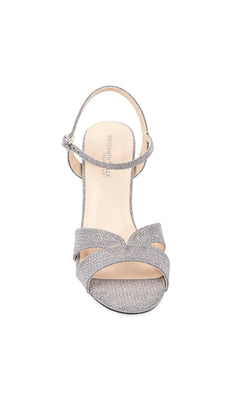 Front view of the Riley High-Heel Silver Prom Shoes: Touch Ups 4656—a silver glittery sandal with ankle strap and open toe, perfect for prom—displayed against a white background.