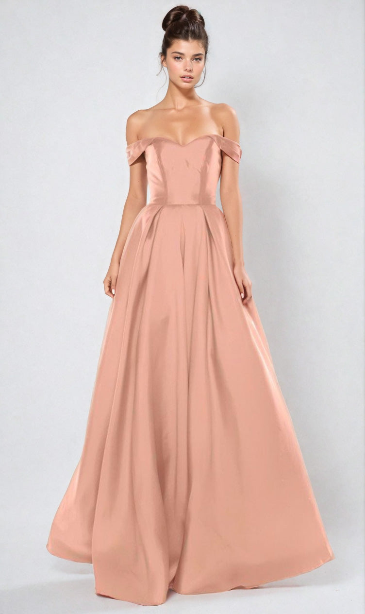 A woman wears the Off-the-Shoulder Long Prom Ball Gown: Chicas C9197—a floor-length blush pink dress with a fitted bodice and full skirt—posed against a plain light background.