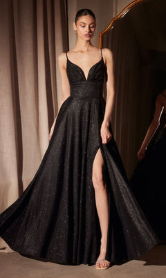 A woman in the Strappy-Back Glitter Prom Gown: Amoris T214, a sleeveless, floor-length evening dress featuring a deep V-neckline, strappy back, thigh-high slit, and subtle sparkling details.