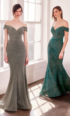 Two women wearing Amoris T602 Off-Shoulder Sweetheart Prom Gowns stand by large windows, their shimmering green dresses glowing in the sunlight.