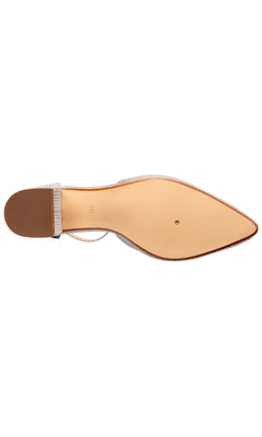 The sole of the Tegan Champagne Shimmer Prom Shoes by Touch Ups 4664, seen from below, features a smooth beige surface and a small block heel—ideal for anyone seeking chic block heel prom shoes.