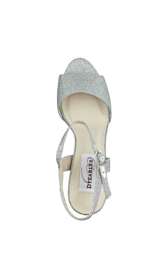 A single Whitta Silver Glitter Prom Shoe (Dyeables 55717) with block heels, ankle strap, and buckle, is shown from above. The open toe reveals an insole label reading "DE FABES.