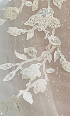 A close-up of the Long Wedding Dress: Andrea and Leo WL070 showcases delicate white lace with 3D floral appliques.