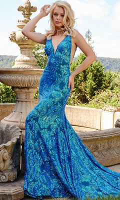 Woman standing outdoors in front of a stone fountain, wearing an iridescent royal Backless Jovani Prom Dress with Sequin Pattern—floor-length, sleeveless, and featuring a deep V-neck for an elegant look.