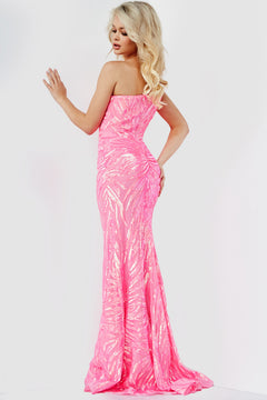 A woman with long blonde hair poses with her back turned and one hand raised, wearing a form-fitting Jovani One-Shoulder Long Sequin-Print Prom Dress against a plain white background.