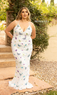 A woman stands outdoors in the Plus-Size Sequin Butterfly Long Prom Dress 14003—a white gown with colorful butterfly designs, thin straps, and a v-neckline. "PRIMAVERA" appears in the background.