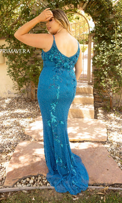 A woman wearing the Plus-Size Long Sequin Prom Dress 14005 in blue stands outdoors on a stone pathway, facing away from the camera with one hand touching her head.