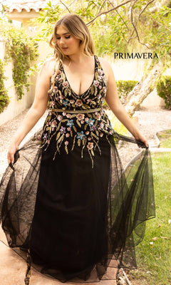 A woman wears the Floral-Beaded Long Black Plus-Size Prom Dress, an elegant evening gown featuring beautiful floral beading.