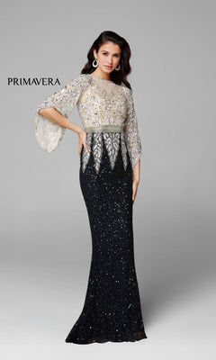 A woman models the Bell-Sleeve Long Beaded Evening Gown 1424 in black and silver, featuring flared sleeves, set against a plain light gray background with “PRIMAVERA” on the left.