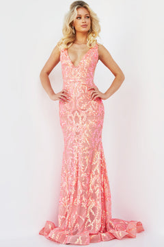 A woman wearing a Jovani Sequin Prom Dress with a plunging neckline and gold sequin embellishments stands against a plain white background.