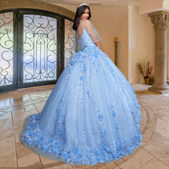 A woman models the Quinceañera Sample Dress QF105, a light blue, embellished gown, standing indoors on a tiled floor and glancing over her shoulder—an ideal choice for your special celebration.