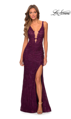A woman in a sleeveless, deep purple La Femme Long Lace Prom Dress with a plunging neckline, thigh-high slit, and cut-out back stands against a white background.