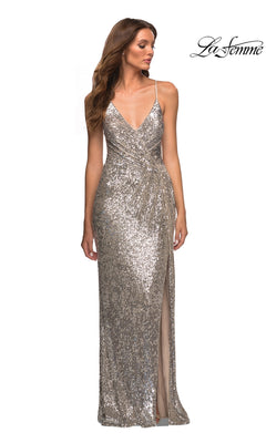 Woman in a La Femme Strappy Faux-Wrap Long Sequin Prom Dress featuring thin straps, a V-neckline, and a high slit; La Femme logo displayed in the top right corner.