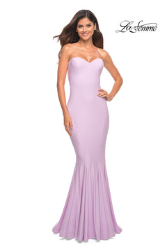 A woman in the La Femme Simple Mermaid Strapless Formal Dress, light purple, smiles against a white background with the La Femme logo.