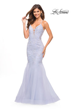 A woman models the Backless Long Lace Mermaid Prom Dress by La Femme in light blue with thin straps, posing against a white background with the "La Femme" logo in the top right corner.