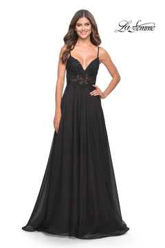 A woman poses against a white background with the "La Femme" logo, modeling the La Femme Long A-Line Prom Dress featuring spaghetti straps and a sheer-lace bodice.