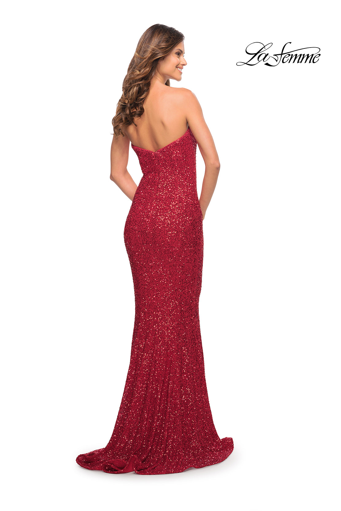A woman in a La Femme Strapless Long Sequin Formal Dress stands with her back to the camera against a white background. The La Femme logo is visible in the top right corner.