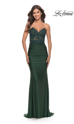 A woman models the Sheer-Lace-Bodice La Femme Strapless Prom Dress, showcasing lace details on the bodice and a fitted satin skirt against a white background.