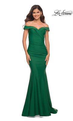 A woman poses and smiles in the fitted, floor-length green La Femme Off-the-Shoulder Long Formal Prom Gown against a white background. The "La Femme" logo is displayed in the top right corner.