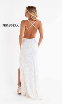 A woman in a backless, floor-length Deep V-Neck Long Sequin Prom Dress with a side slit and crisscross straps faces away. "PRIMAVERA" appears on the left.