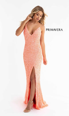 A woman models the Open-Back Bright Long Sequin Prom Dress 3291B in peach, featuring a deep V-neckline, spaghetti straps, and a front slit, against a white background. The word "PRIMAVERA" appears beside her.
