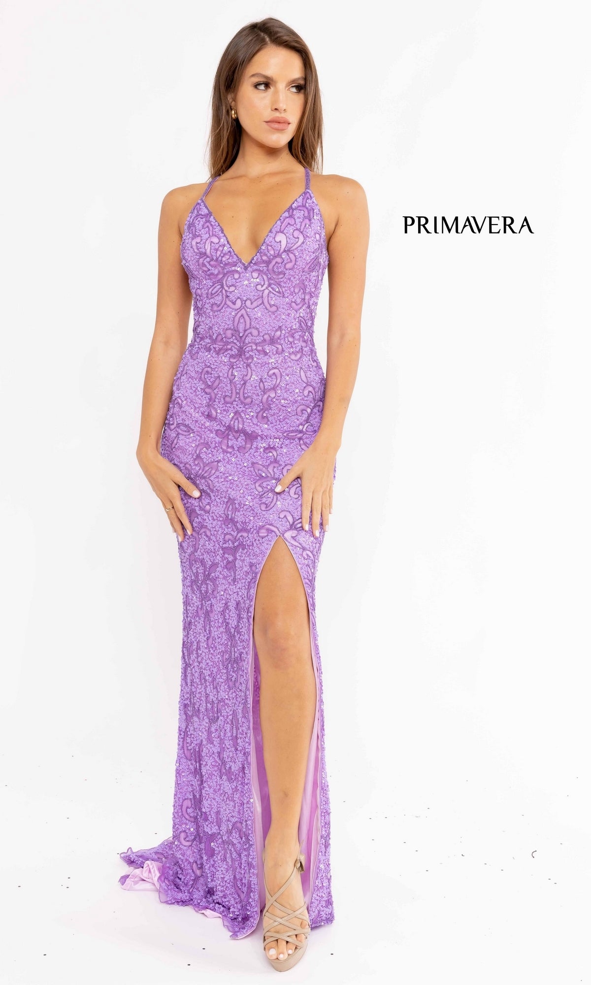 Woman wearing the Bright Sequin-Pattern Long Prom Dress, a fitted sleeveless formal gown with lavender lace and thigh-high slit, stands against a plain white background. 