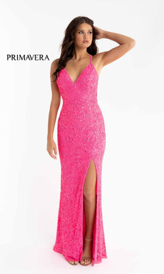 A woman poses against a white background in the Bright Sequin-Pattern Long Prom Dress, a fitted, vibrant pink gown featuring beaded details, a thigh-high slit, and an open back. "PRIMAVERA" is displayed on the left.