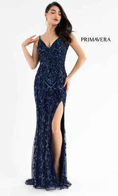 A woman models the Open-Back Primavera 3749 Long Sequin Prom Dress—navy blue with a thigh-high slit and sequin details—against a white background, with "PRIMAVERA" displayed beside her.