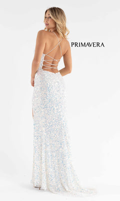 A woman poses in the Pastel Color Sequin Primavera Wrap Dress 3791—an affordable, floor-length gown with white sequins, crisscross open back, and side slit—against a plain white background. "PRIMAVERA" appears beside her.