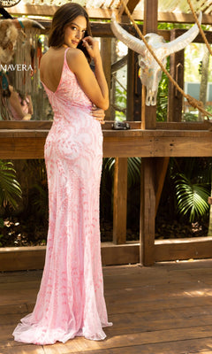 A woman poses on a wooden deck in the Pastel V-Neck Long Sequin Prom Dress 3793, a floor-length fitted gown with shimmering bead details. She stands near a railing and bull skull, glancing over her shoulder in this elegant formal dress.
