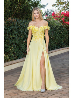 A woman stands outdoors in a Long Corset-Back Prom Dress with Beaded Bodice, featuring a light yellow color, off-the-shoulder style, thigh-high slit, and silver high heels. Shrubs and flowers are visible in the background.