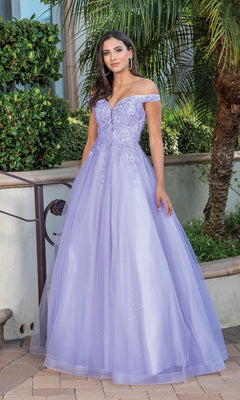 A woman in an Off-Shoulder Prom Ball Gown with Corset Back, featuring lavender floral embroidery and a full tulle skirt, stands outdoors near greenery.