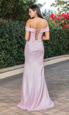 A woman stands outdoors facing away, wearing the Off-the-Shoulder Shimmer Prom Dress with Corset in light pink. Shrubs and flowers form a lush backdrop.