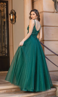 A woman wearing the Dancing Queen 4328 Long Glitter Prom Dress stands on stairs, glancing over her shoulder, with a stone building and black lantern in the background.