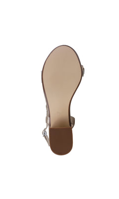 A bottom view of the Champagne Twisted Low Heel Prom Shoes Ruby 4591 featuring a flat beige sole, textured brown low heel, and metallic buckle strap—ideal for understated prom style.